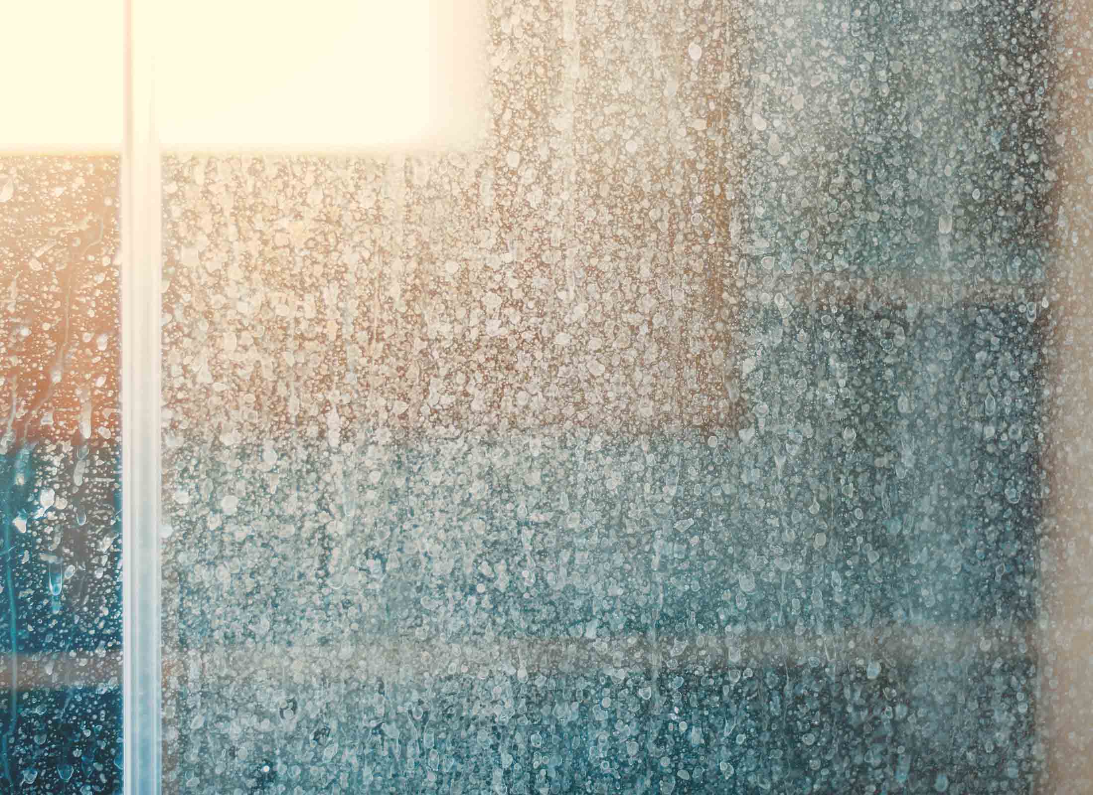 Glass surface with heavy water stains