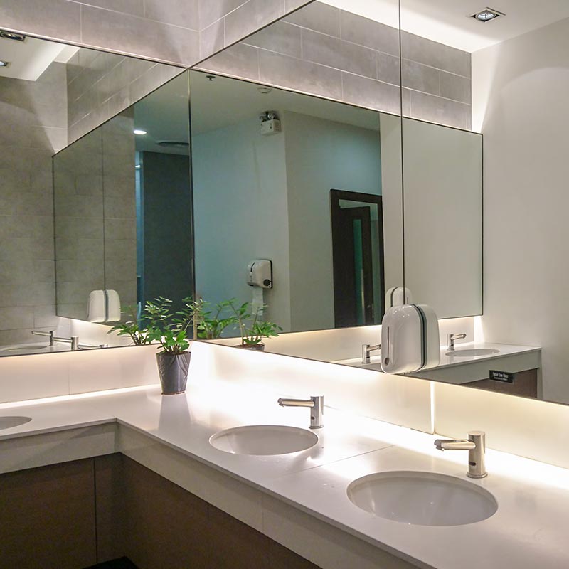 Hotel Bathroom Interior with Wrap-Around Mirror