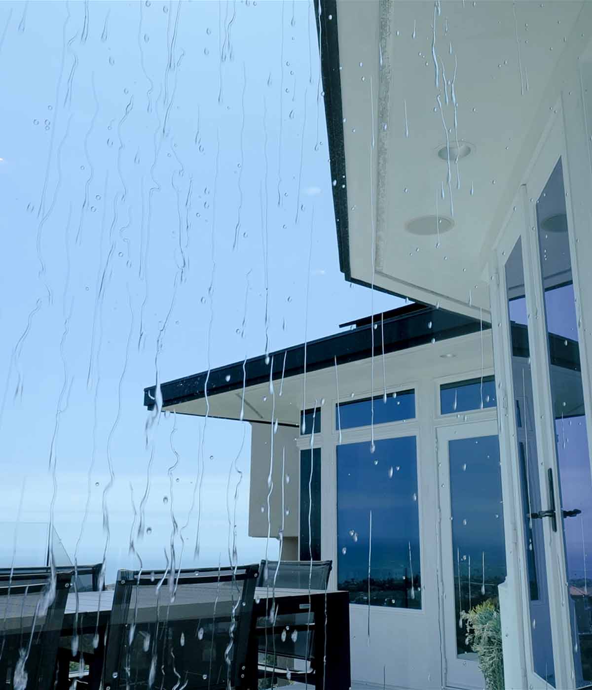 Water Drops Beading Down Interior House Window from the Side