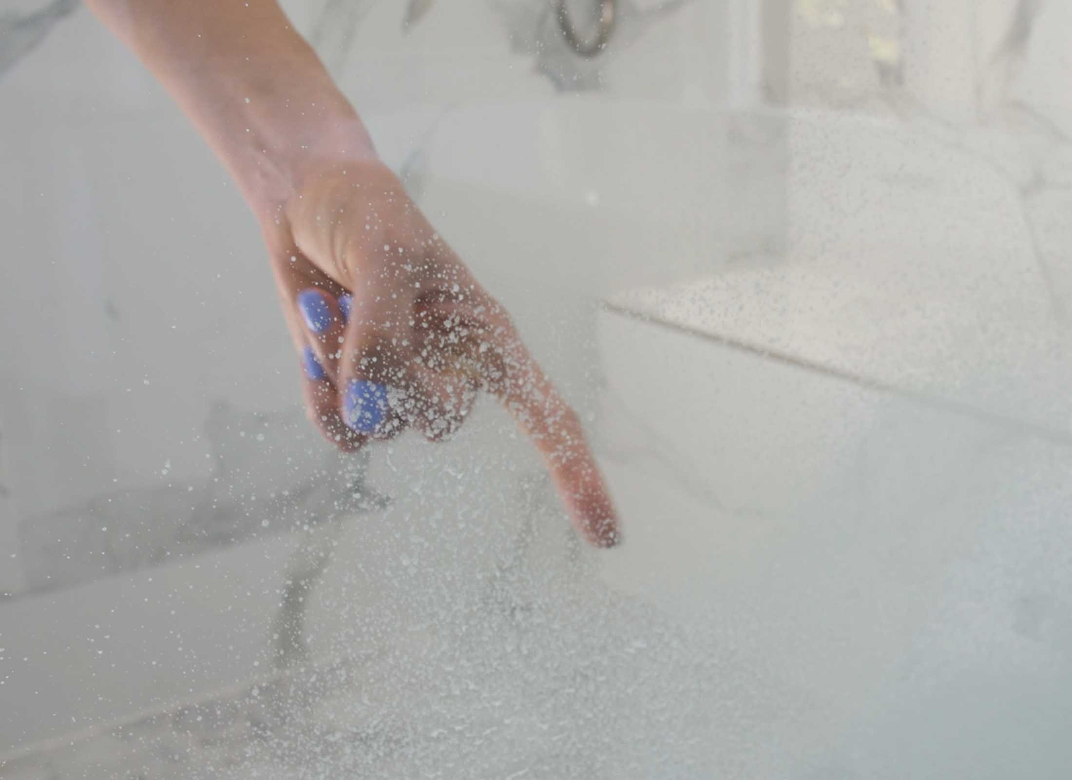 Woman Finger Pointing To Shower Glass Hard Water Stains