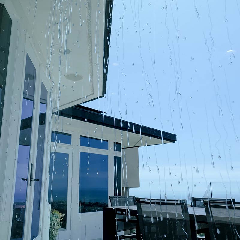 Water Drops Beading Down Interior House Window