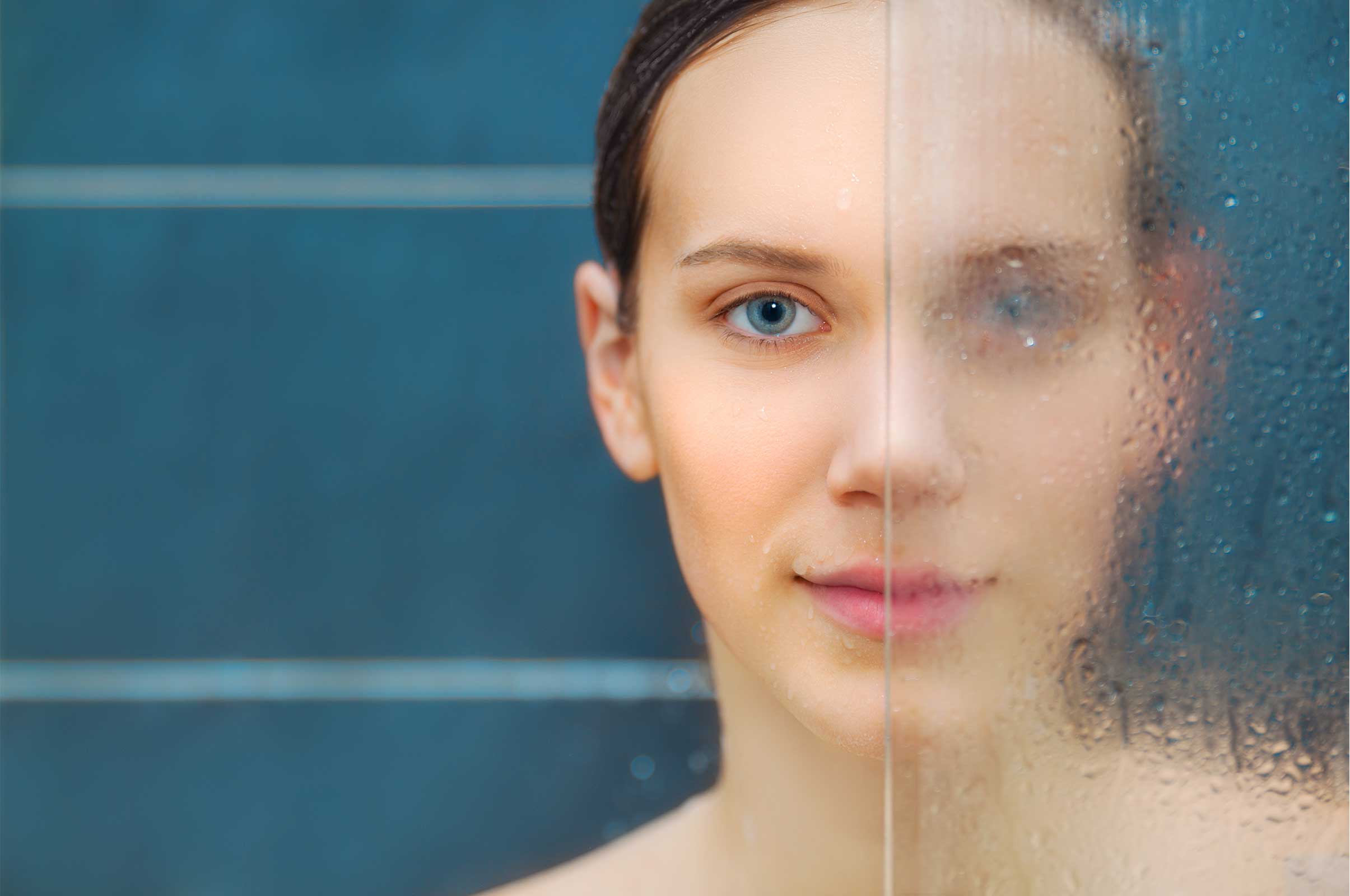 Woman Behind Treated and Untreated Shower Glass